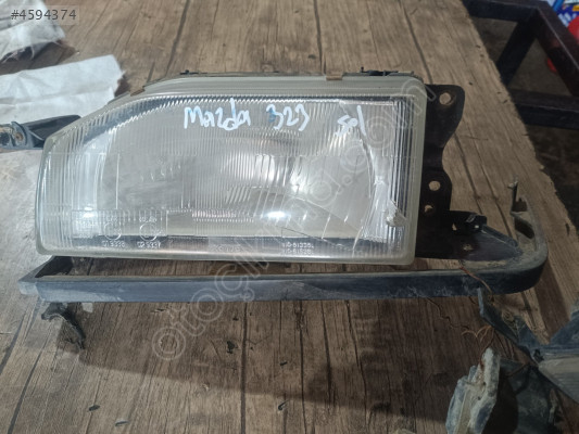 Mazda 323 sol ön far